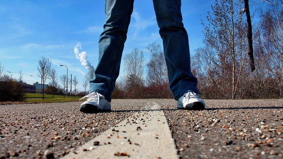 man with jeans and sport shoes