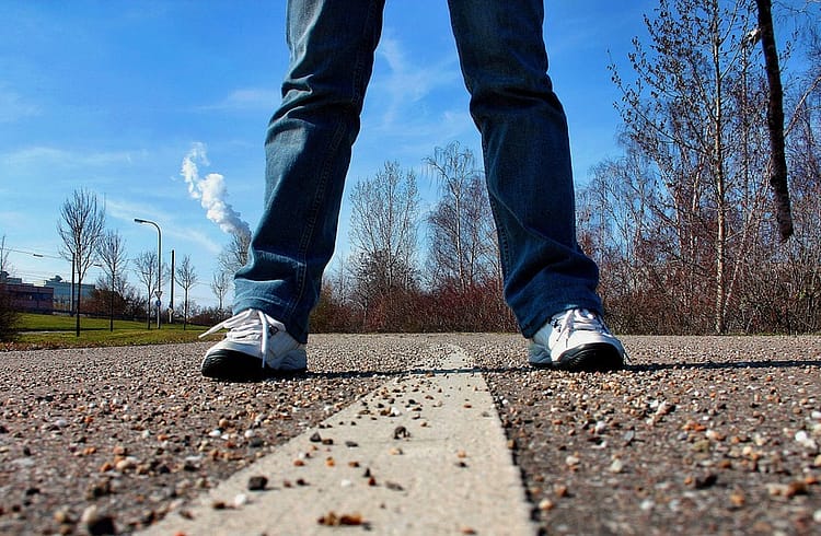 man with jeans and sport shoes